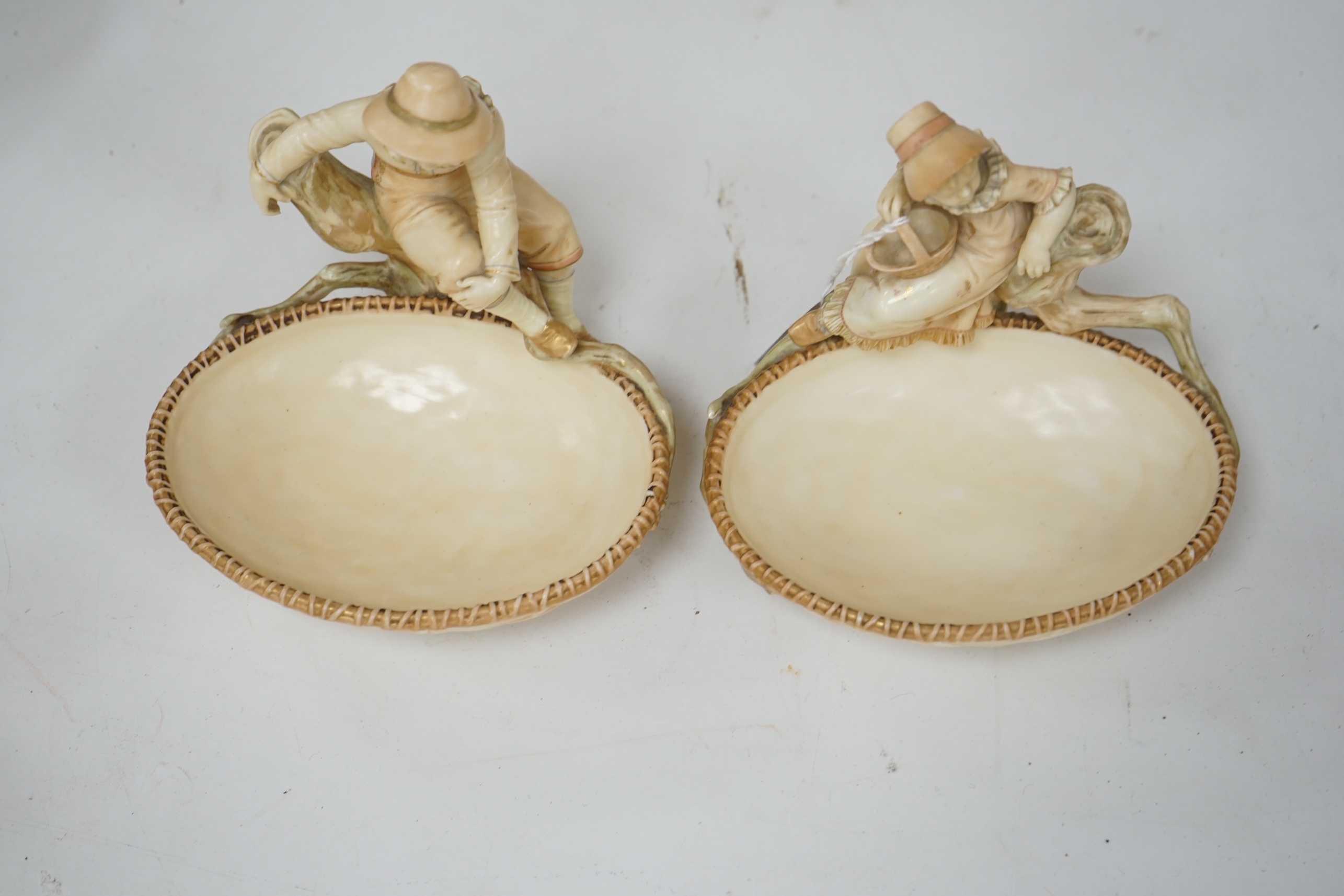 A pair of Royal Worcester sweetmeat dishes modelled by James Hadley, impressed numbers 775 and 776, 16cm. Condition - good